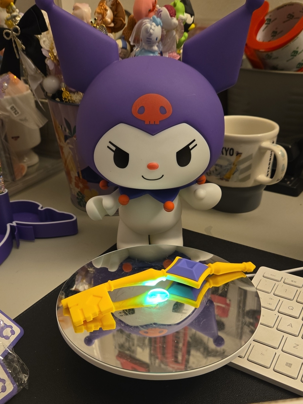 Purple Kuromi figure appears to be a Sanrio Sofvimates doll.